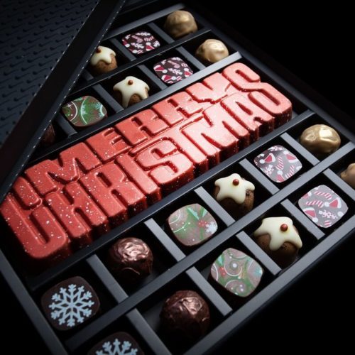 Luxury Christmas chocolate gift box of 24 handmade chocolates and MERRY CHRISTMAS spiced caramel bar.